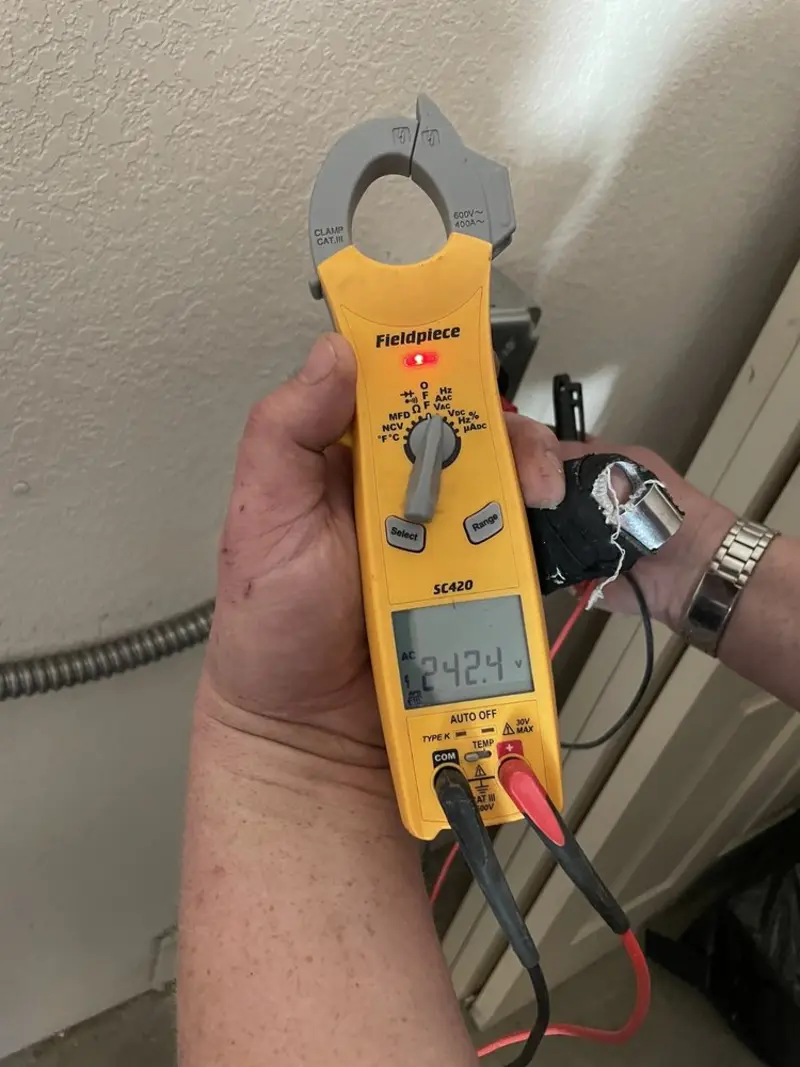 Voltage testing with clamp meter during Ceiling Fan Installation in Easttown